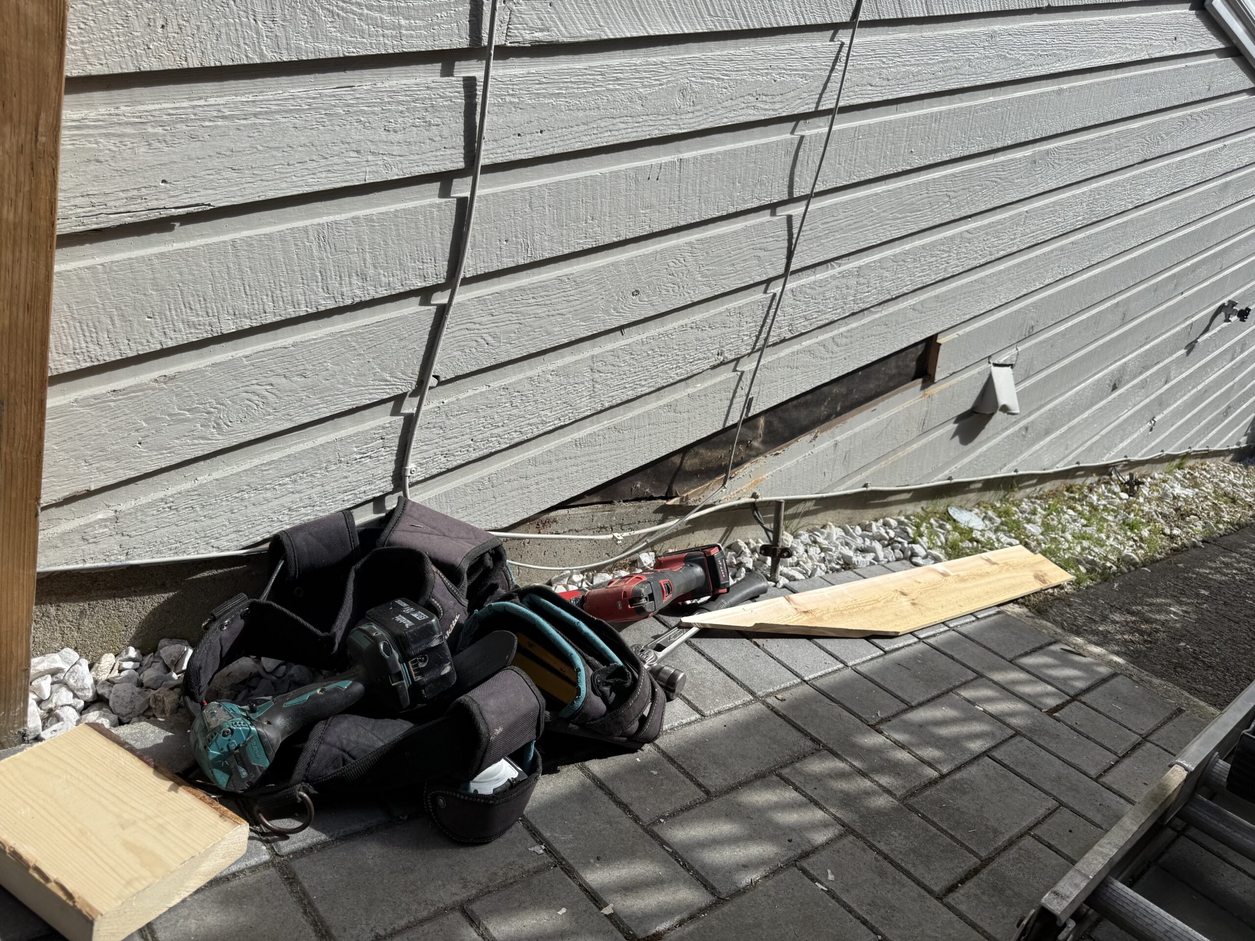 Exterior wood siding repair in progress